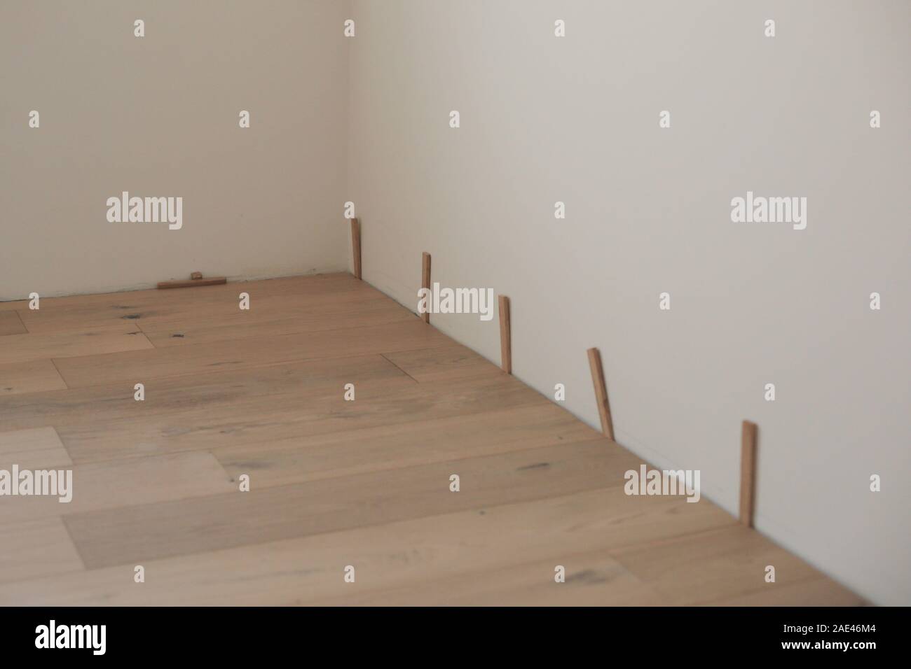 New Laminate or Parquet floor Installation in home house Stock Photo