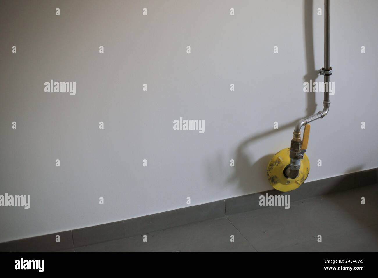 Natural Gas main pipe on white wall in house Stock Photo