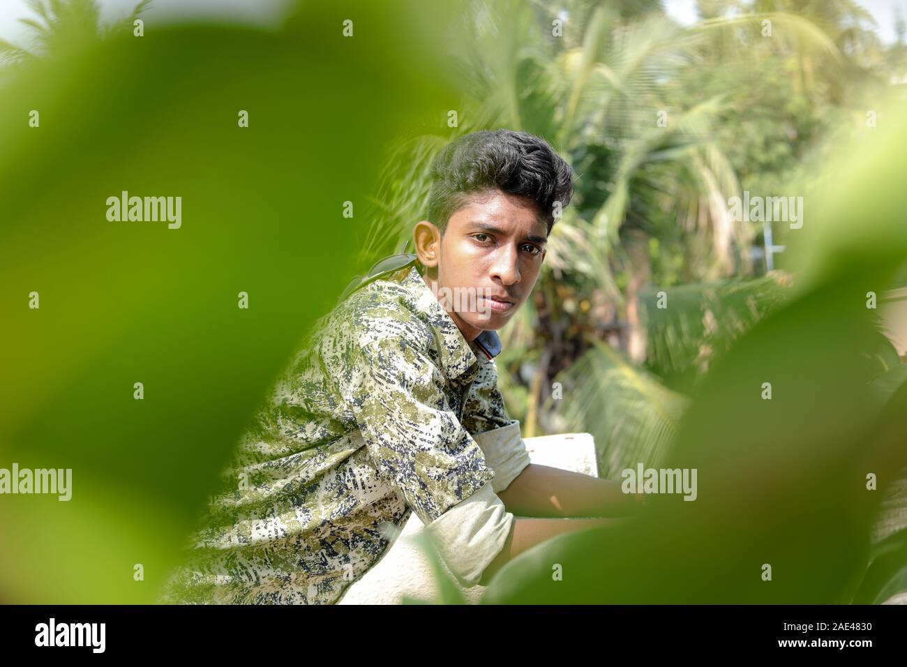 Profile of a Teenage Indian Boy Looking at outsides Stock Photo