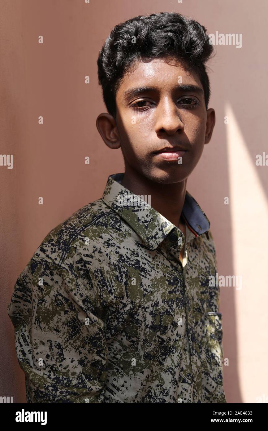 Profile of a Teenage Indian Boy Looking at outsides Stock Photo