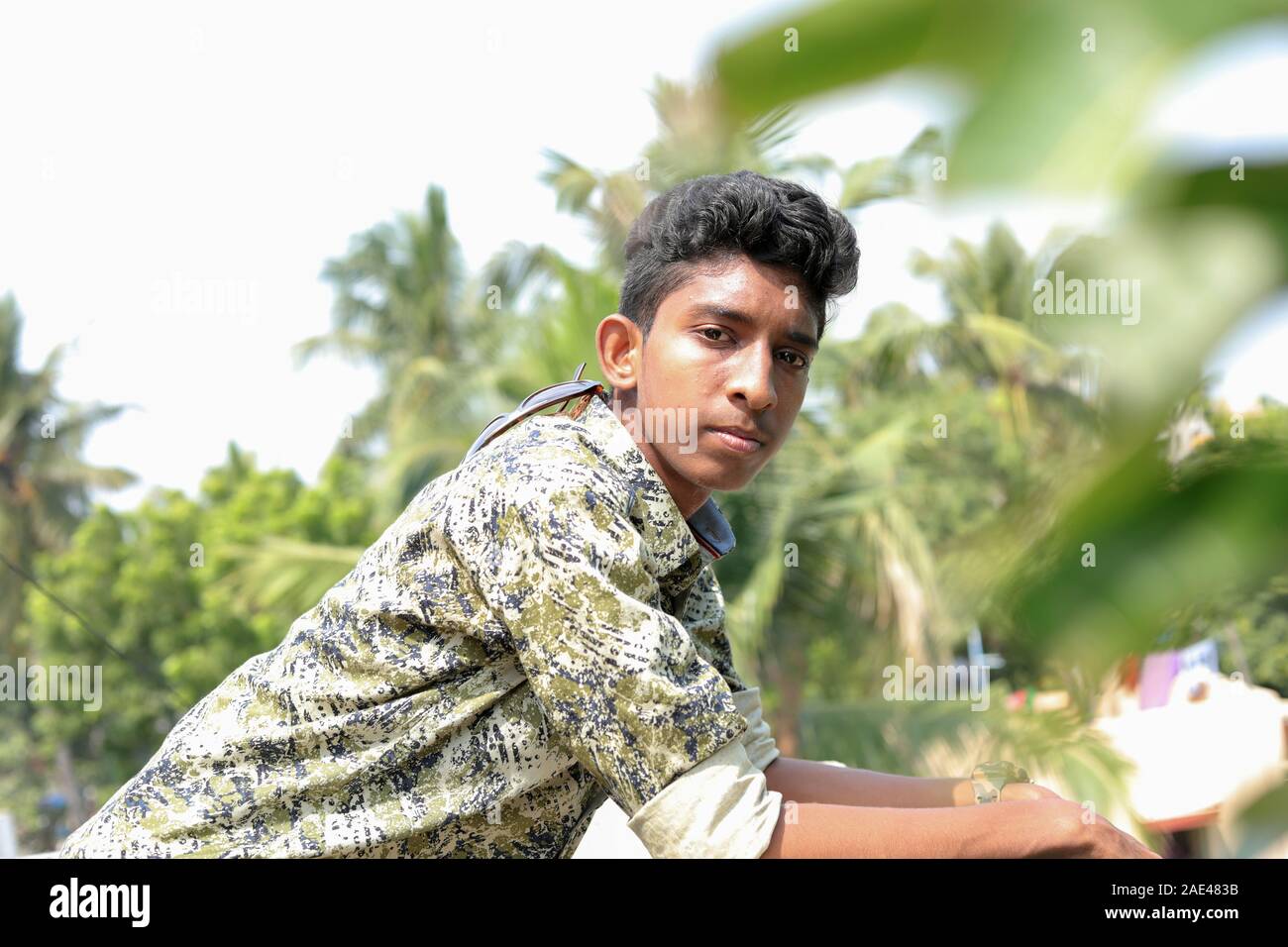 Profile of a Teenage Indian Boy Looking at outsides Stock Photo