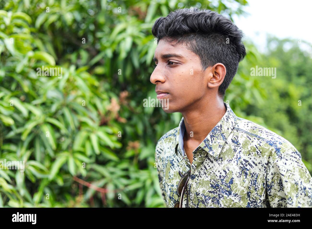 Profile of a Teenage Indian Boy Looking at outsides Stock Photo