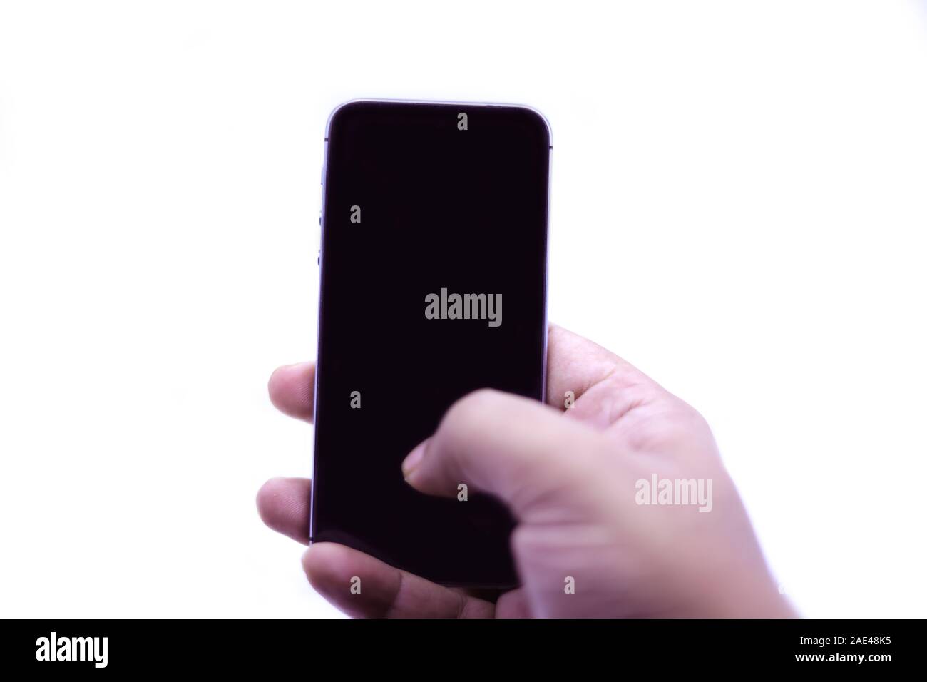Man hand holding black smartphone isolated on white background Stock ...