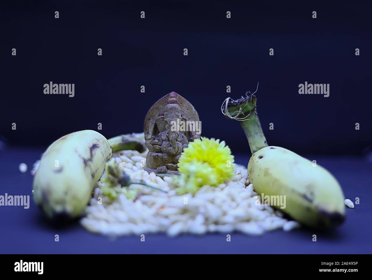 Saraswathi Pooja and Ayudha Pooja Celebrations - Hindu God Vinayaga with banana, flowers and pori Stock Photo