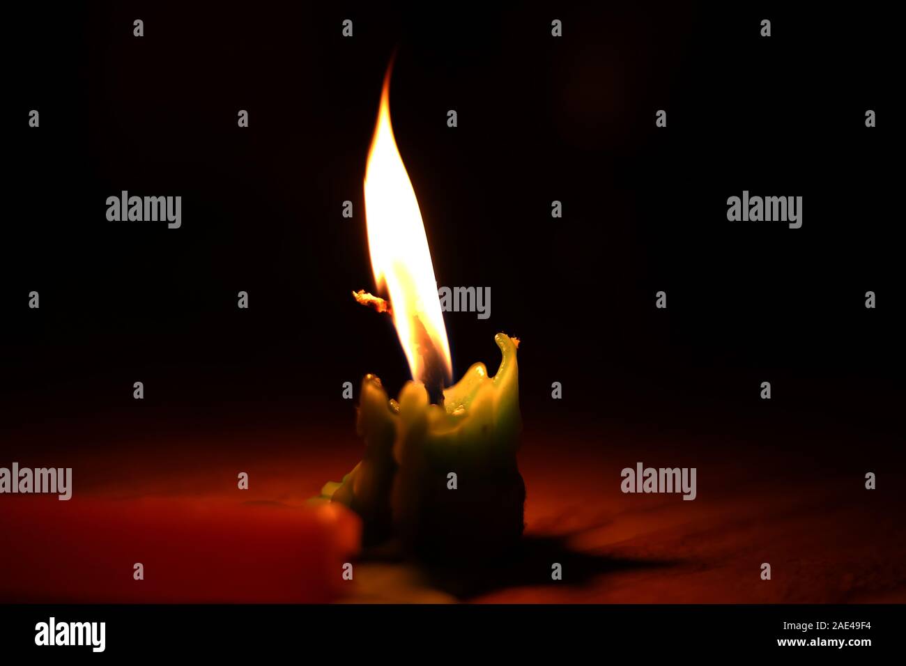One light candle burning brightly in the black backgrounds Stock Photo ...