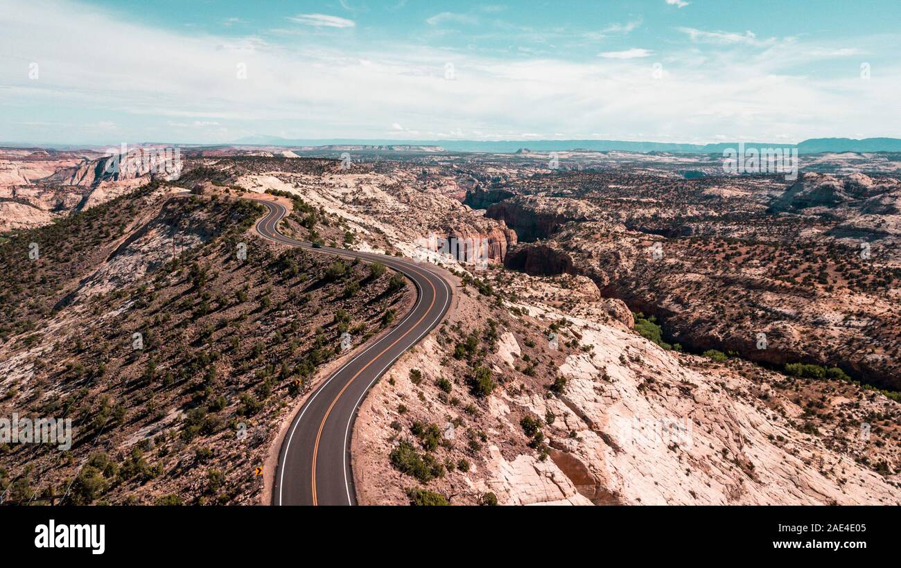 aerial view of country road winding through canyon landscape Stock Photo