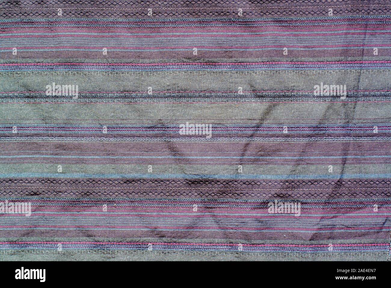 Fabric texture with horizontal stitches. Multi-colored stripes. Stock Photo