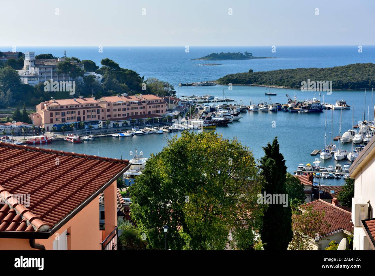 View Over Roofs Buildings Down To Harbour And Boats In Old Town Vrsar