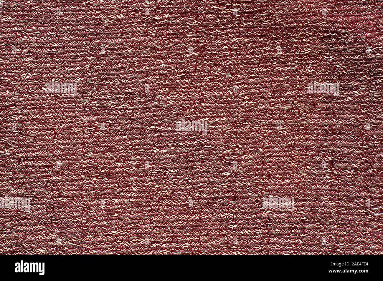 The texture of the fabric. Dark red with white spots, crumpled dense fabric. Copy space. Stock Photo