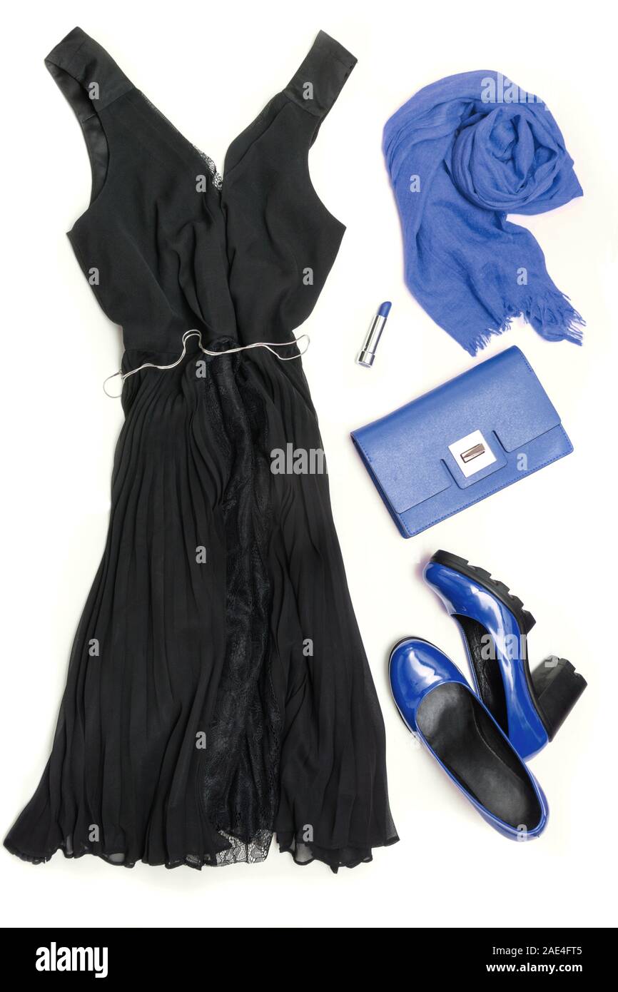 Elegant little black dress and classic blue accessories for special date or holiday. Cocktail dress outfit, night out look on white. Blue clutch, shoe Stock Photo