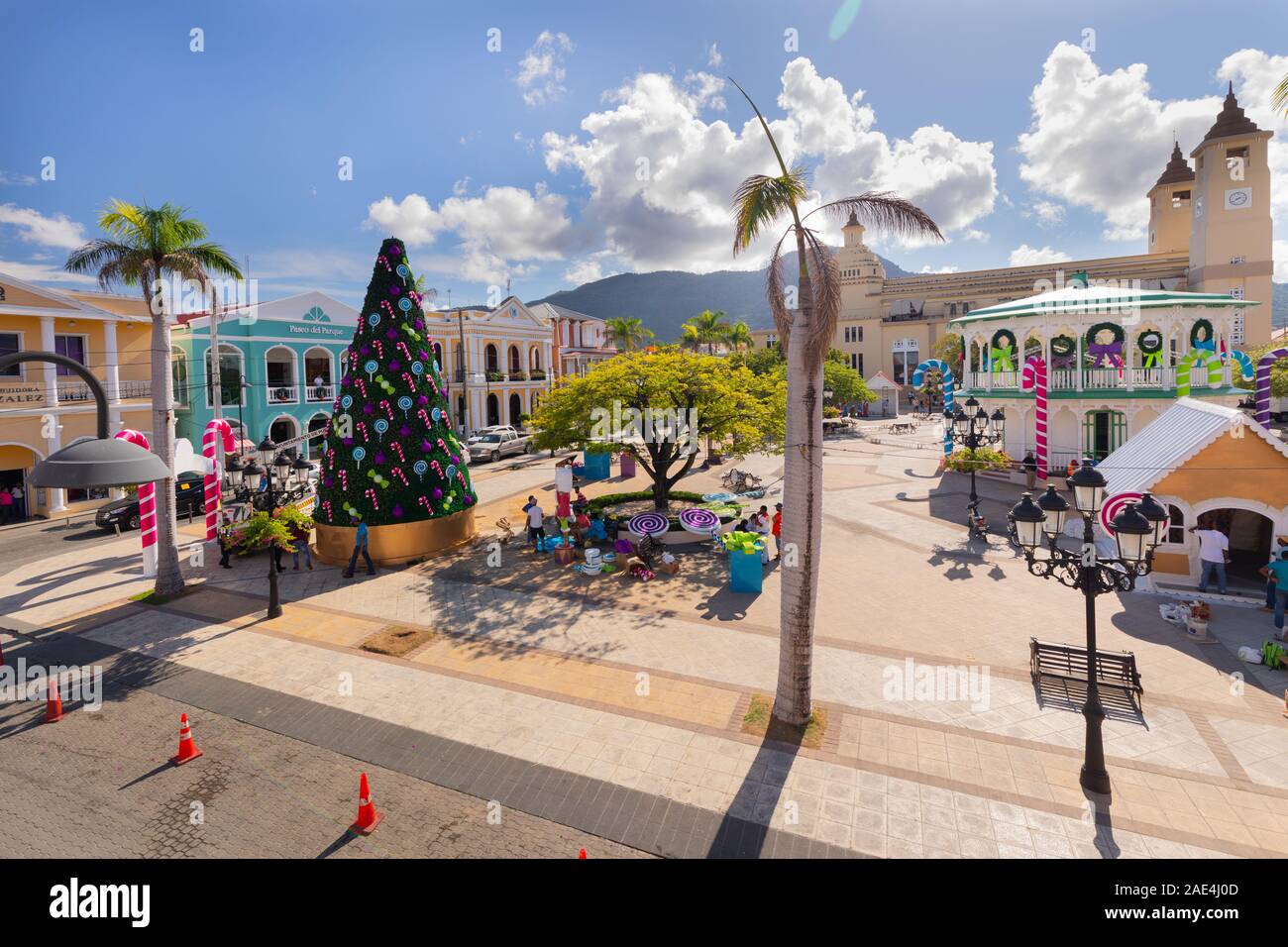 Workers putting up Christmas decorations in the Latin American town square of Puerto Plata, Dominican Republic on the island of Hispaniola. Stock Photo