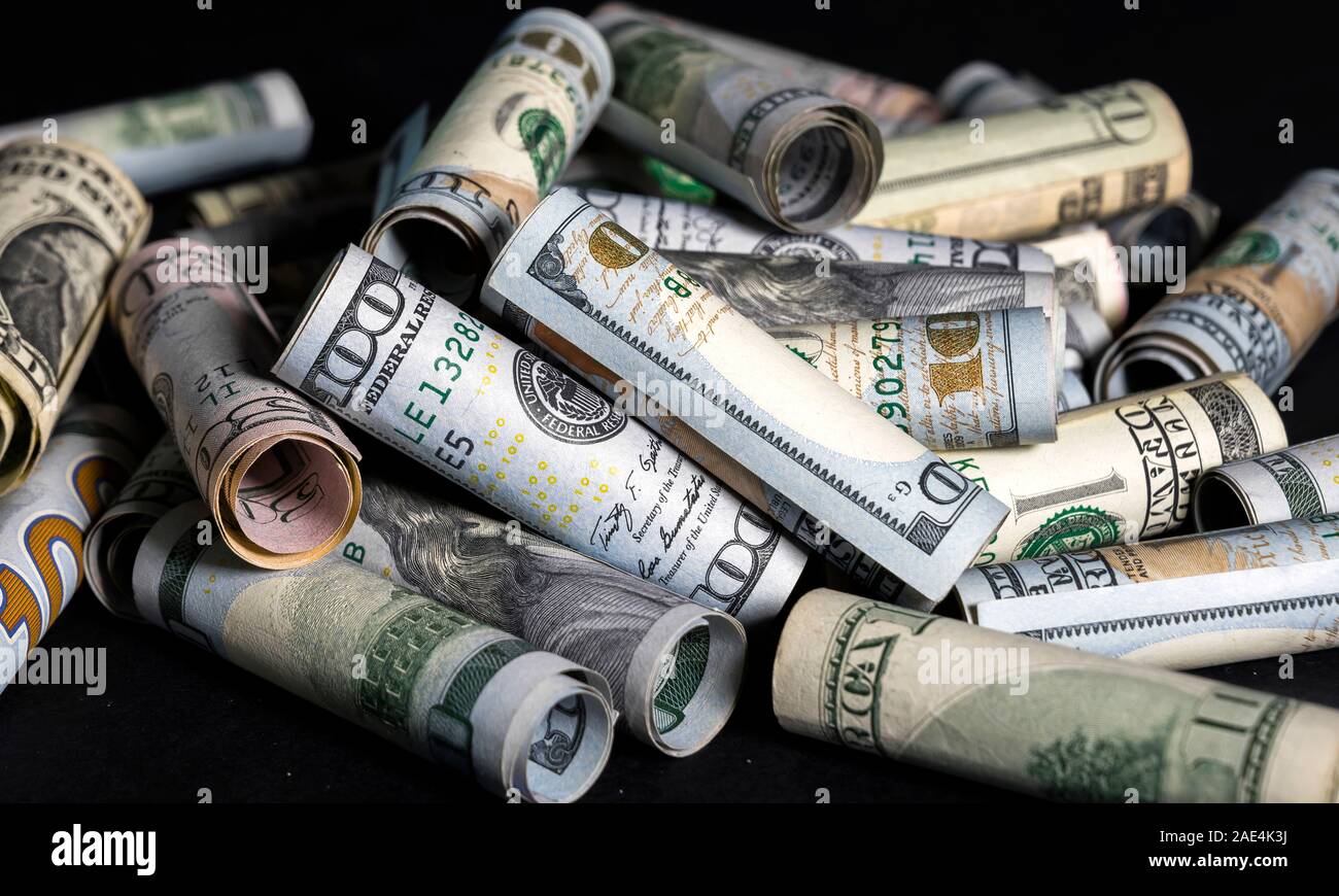 Banknotes of American cash dollar bills of various denominations are