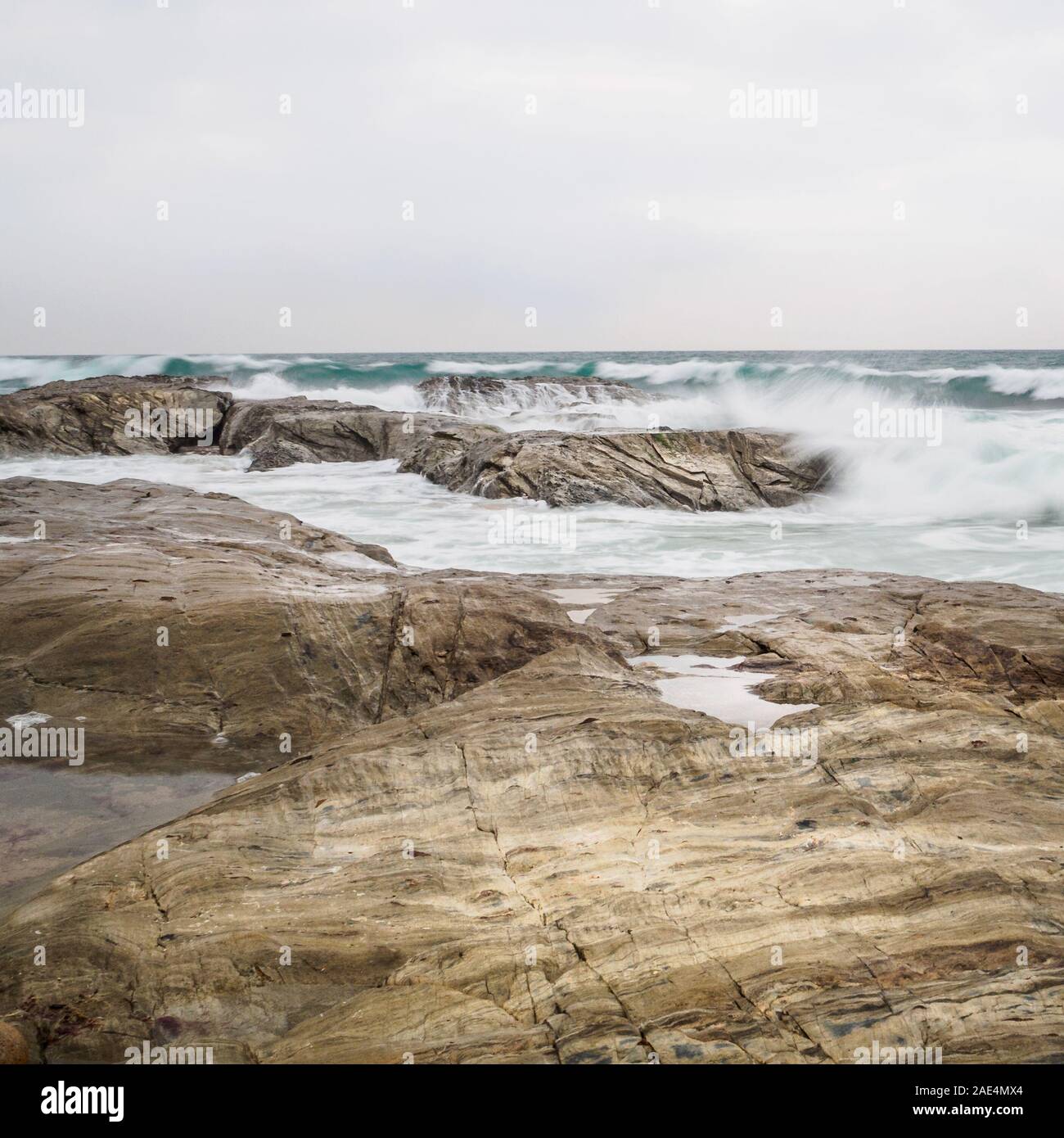 Long exposure of waves breaking on rocks, Atlantic Ocean, Portugal Stock Photo