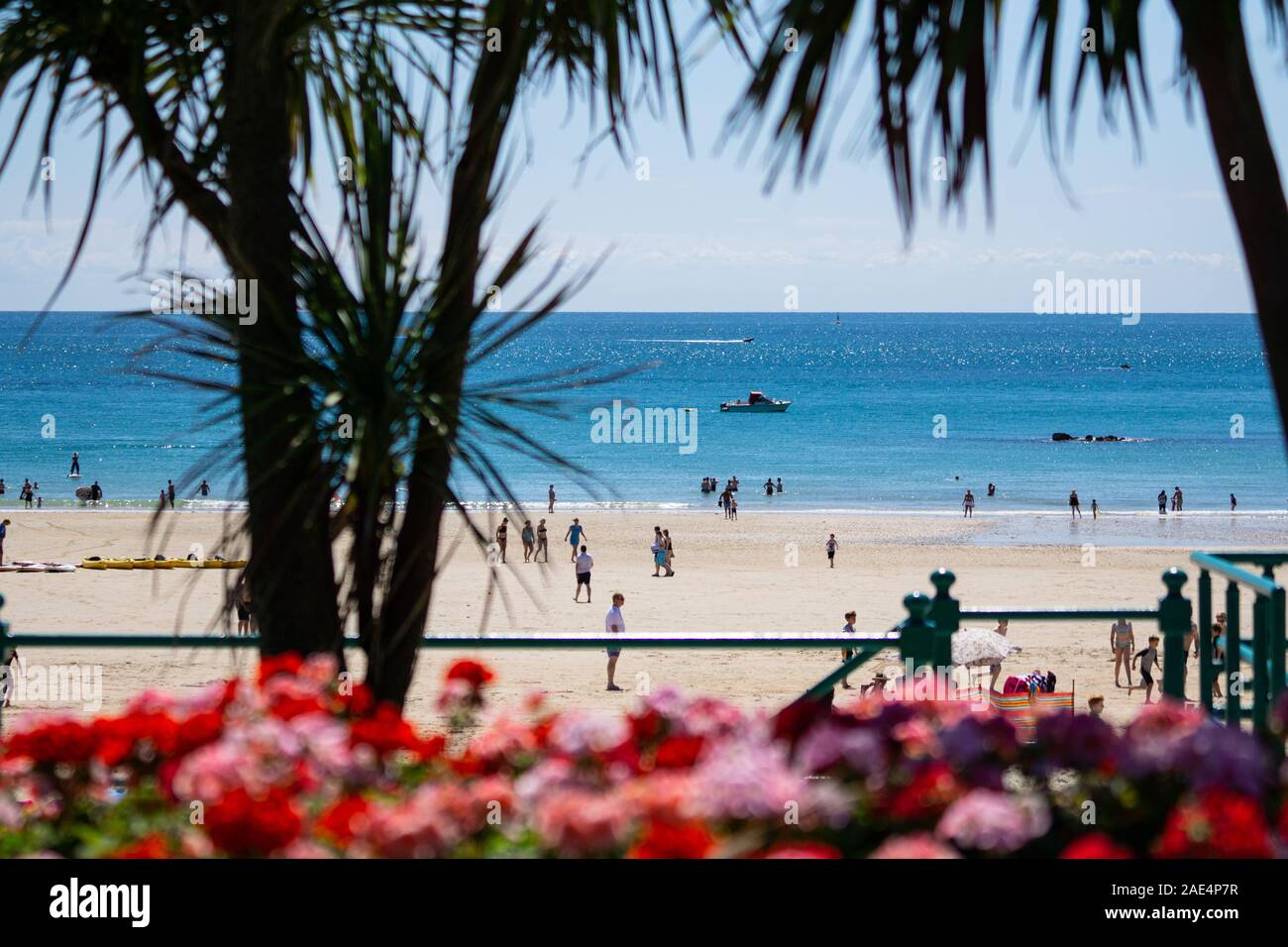 People enjoying the beach on a summers day at St.Brelades Bay,Jersey,Channel Islands Stock Photo