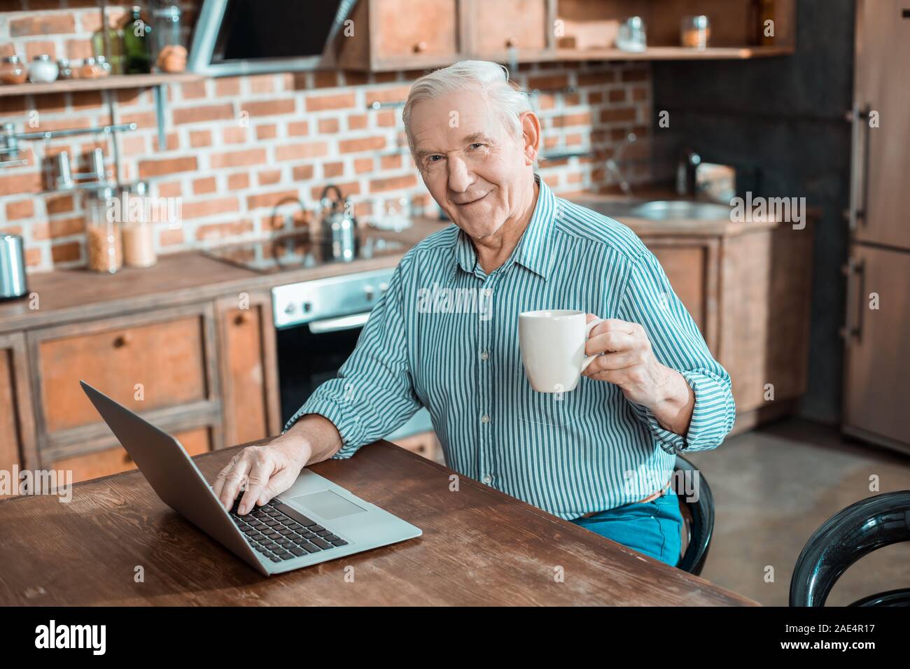 Cheerful positive man looking at you Stock Photo
