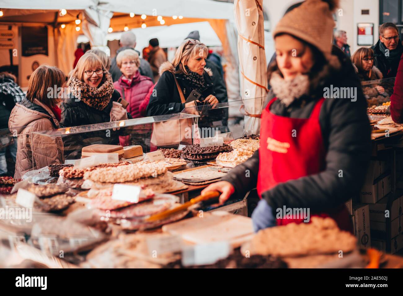 Tübingen, Germany - December 6, 2019: Chocolate market chocolART with christmas booths and stalls with many people standing in crowds drinking mulled Stock Photo