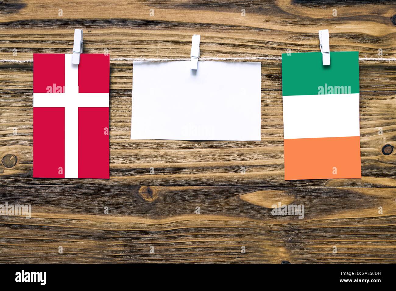 Hanging flags of Denmark and Ireland attached to rope with clothes pins ...