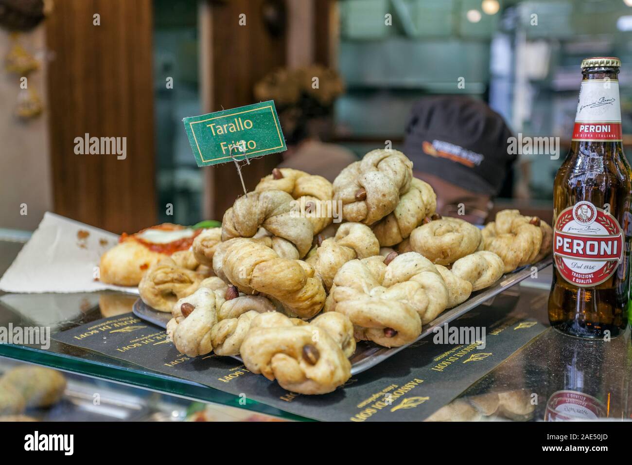 Fried Tarallo, an Italyan Salted Biscuit,  and beer, Street food from Naples, Campania, Italy, EU Stock Photo