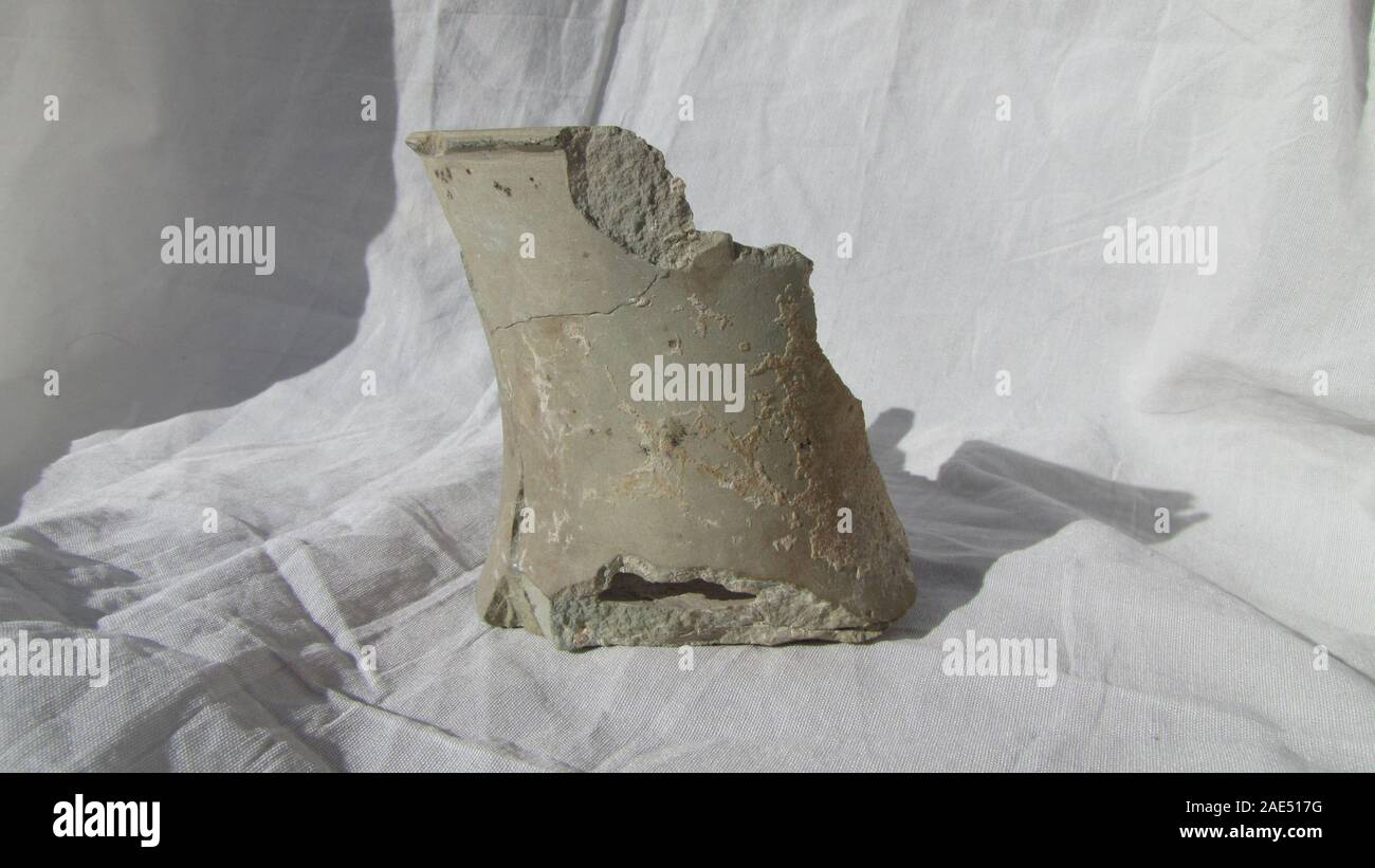 isolated old grungy broken ancient pottery vase from middle east repair