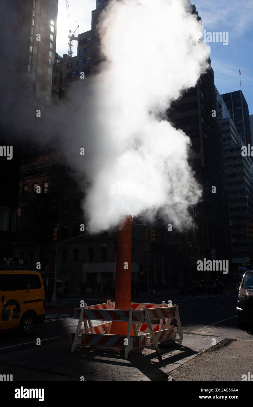 Steam coming out of street in New York city Stock Photo