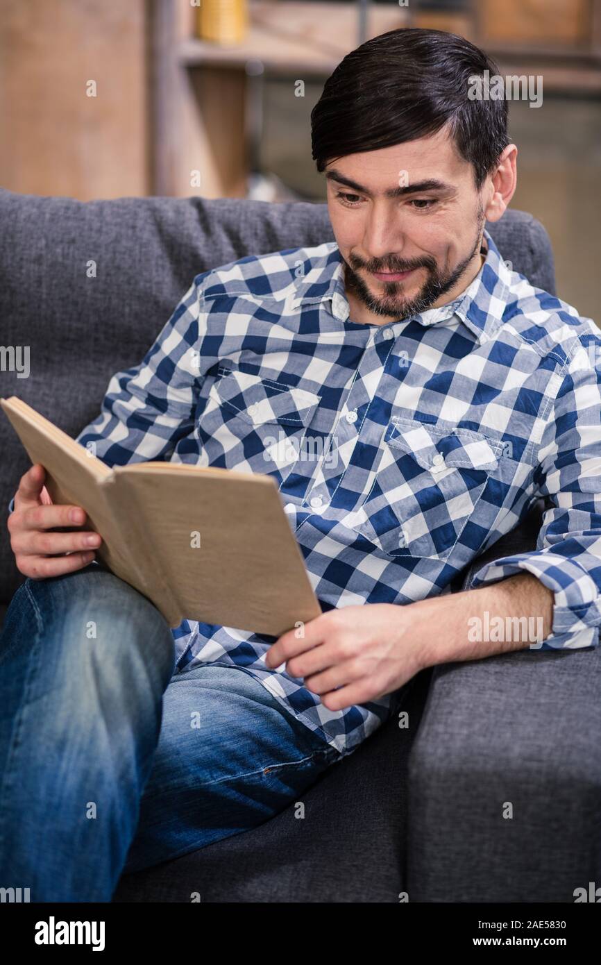Young man reading a book hires stock photography and images Alamy