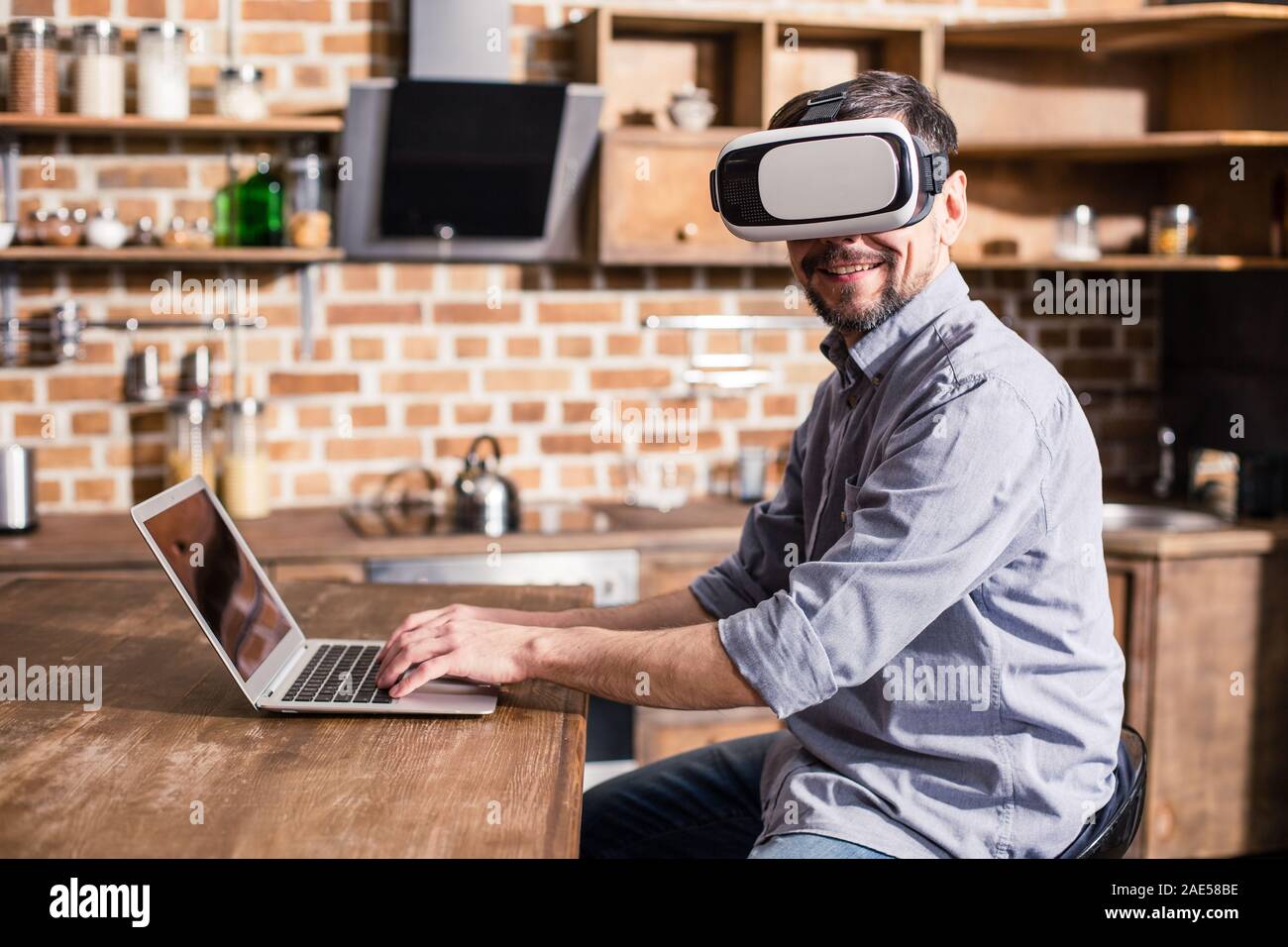 Successful businessman wearing VR glasses Stock Photo - Alamy