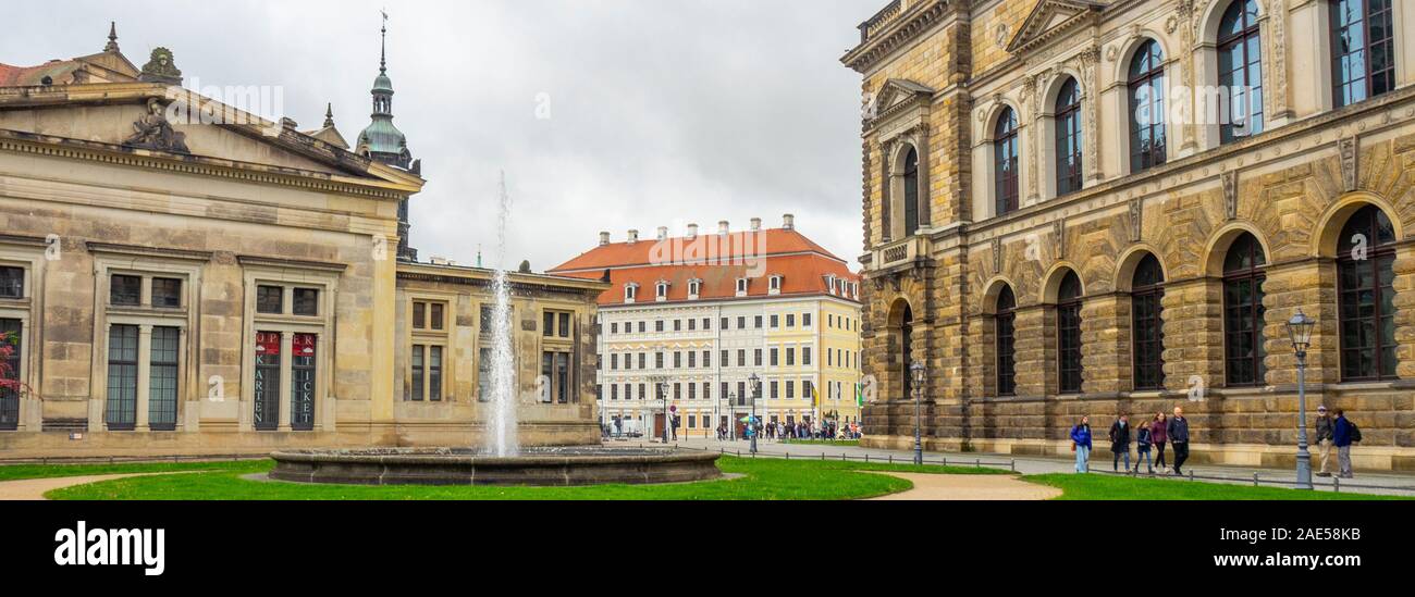 Fountain in Theatreplatz surrounded by Zwinger and Schinkelwache, and Hotel Taschenbergpalais Kempinski in background Altstadt Dresden Saxony Germany. Stock Photo