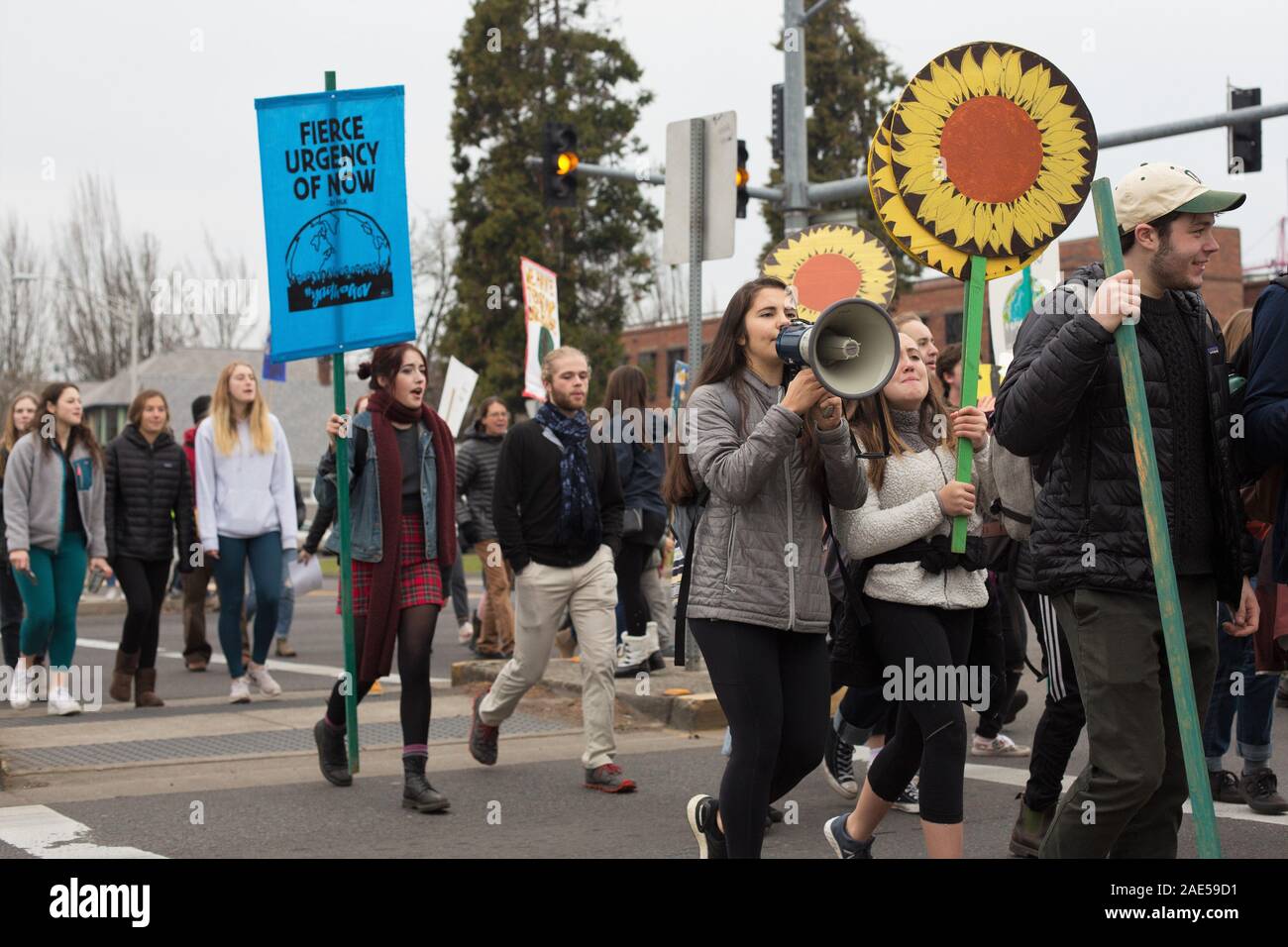Youth marching anc chanting at the climate strike rally in Eugene, Oregon, USA. Stock Photo