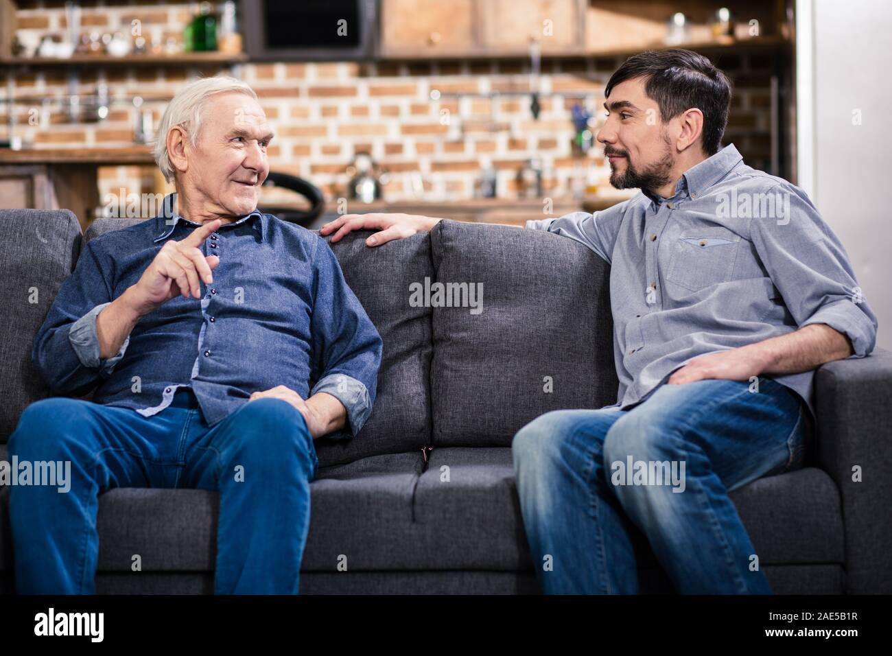Wise man talking with his son Stock Photo