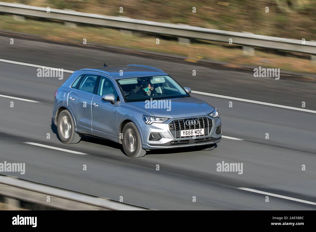 2019 Audi Q3 Sport 35 TFSI S-A Blurred moving car traveling at speed on the M61 motorway; Slow camera shutter speed vehicle movement Stock Photo