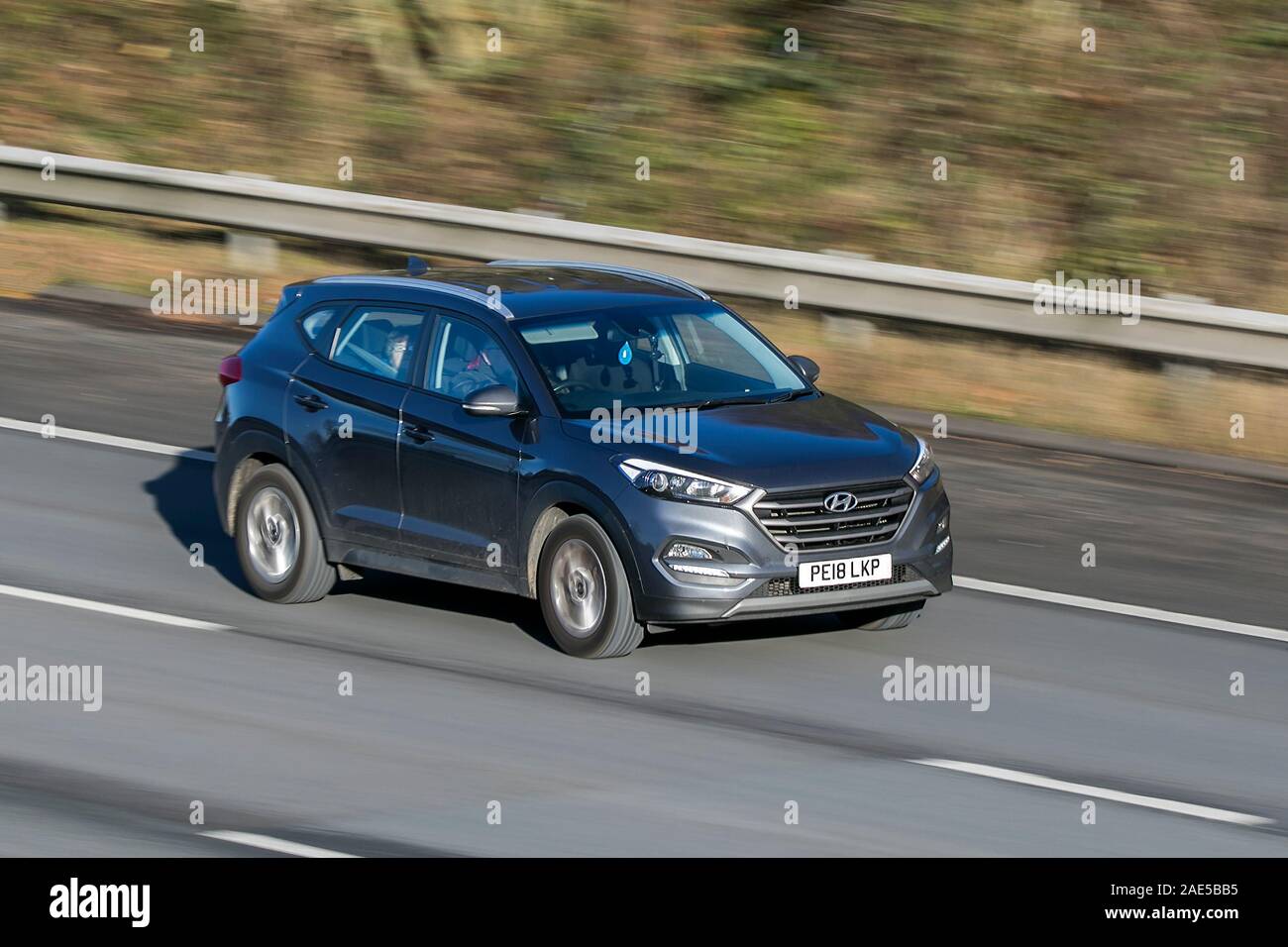 Blurred moving car HYUNDAI Tucson Se Nav B-Dr 2Wd traveling at speed on the M61 motorway Slow camera shutter speed vehicle movement Stock Photo