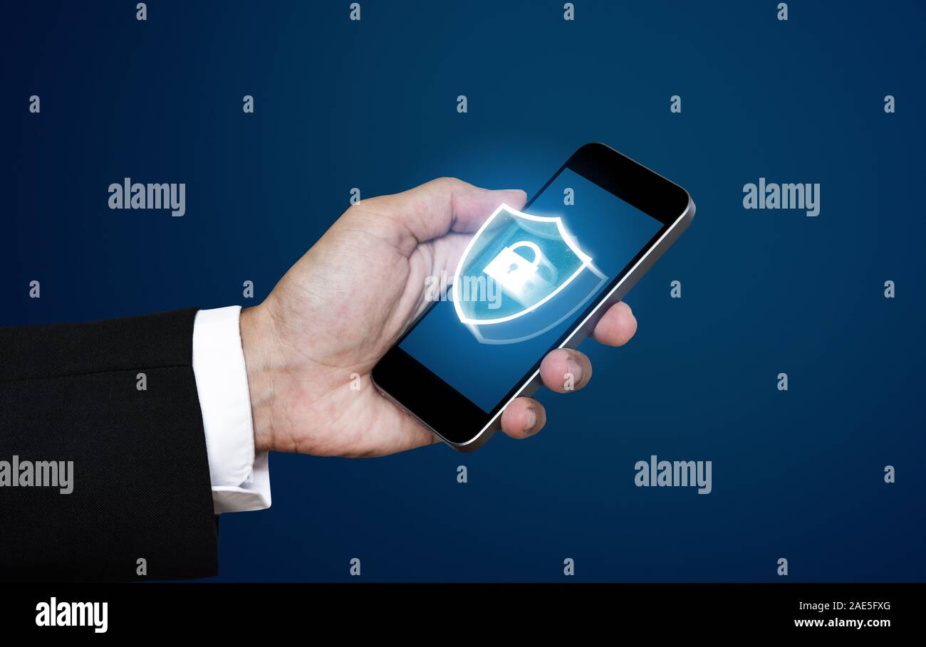 Mobile phone data security and verification system technology. Businessman using mobile smart phone with lock icon on screen Stock Photo