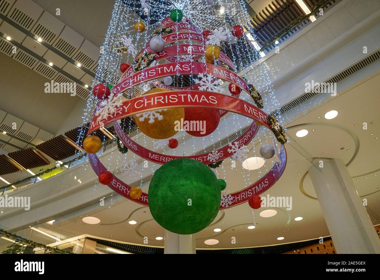 Multilevel shopping mall interior decorated with Christmas decoration in Beijing, China.Shopping mall decorated for Merry Christmas and New Year. December, 25th, 2019 Stock Photo