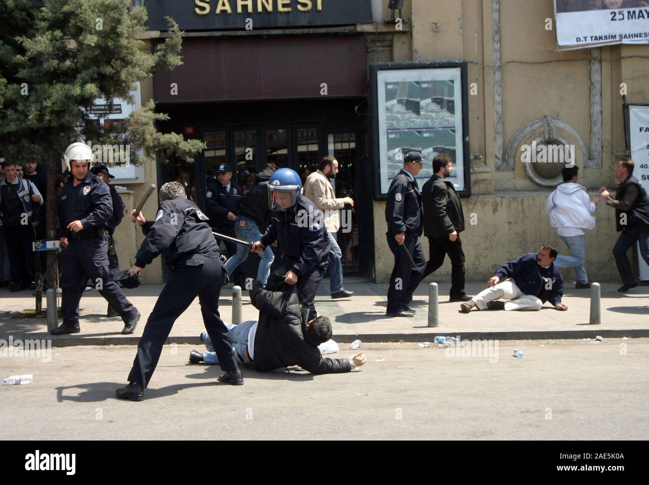 ISTANBUL, TURKEY - MAY 1: International Workers Day. Turkish riot police officers detain a protester on May 1, 2007 in Istanbul, Turkey. Taksim Square is the center of the protest and celebrations. Stock Photo