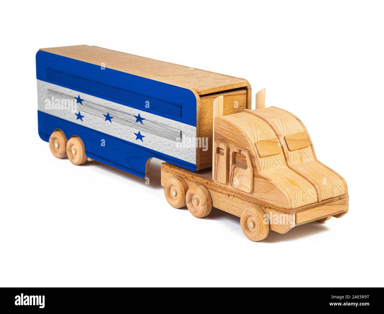 Close-up of a wooden toy truck with a painted national flag Honduras. The concept of export-import,transportation, national delivery of goods Stock Photo