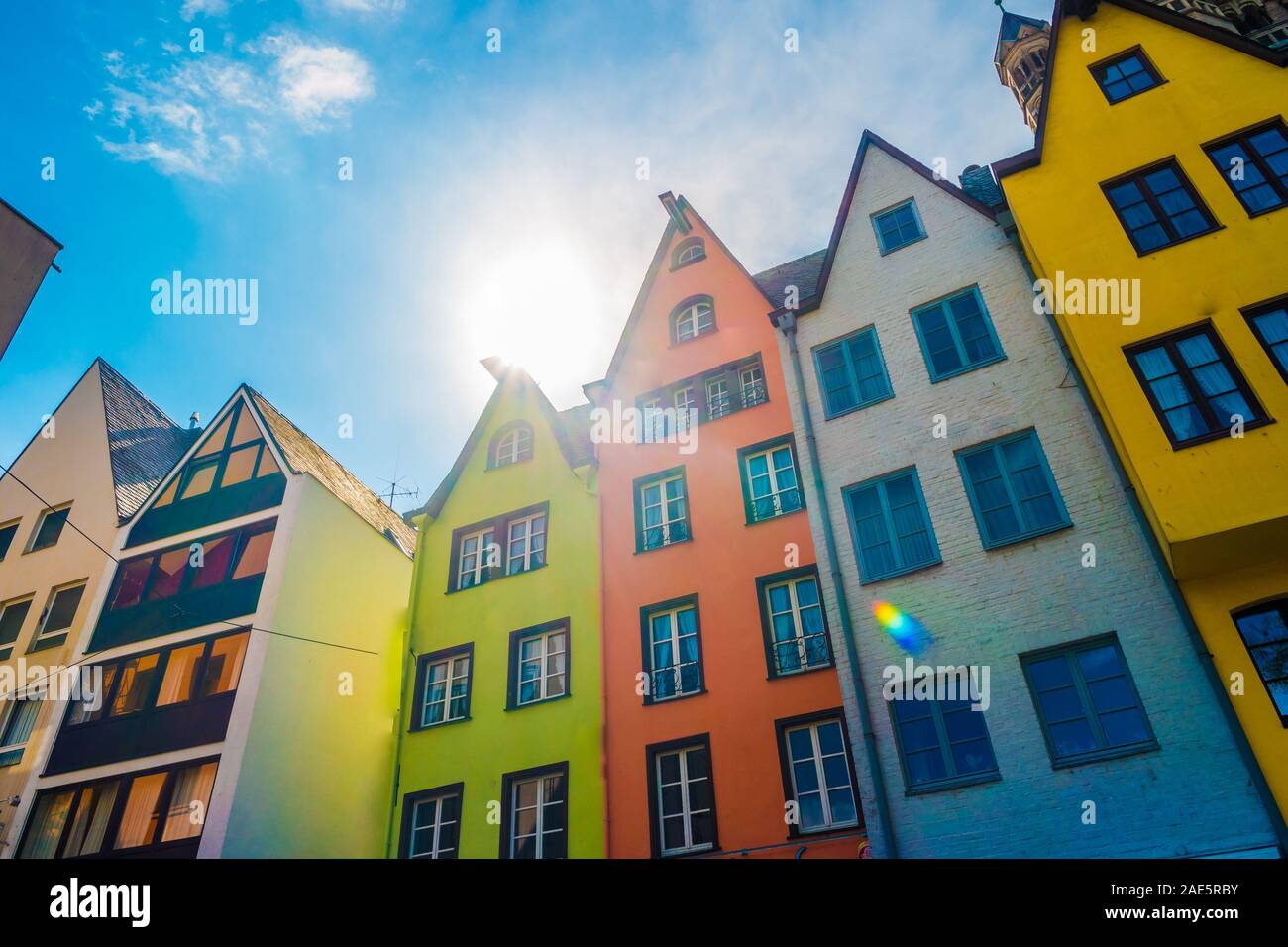 Colorful buildings along an embankment and the High Cathedral of St ...