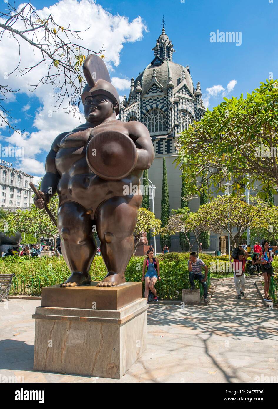 Botero sculpture in the Botero plaza (with the Rafael Uribe Uribe Palace of Culture in the background) in downtown Medellin, Colombia. Stock Photo
