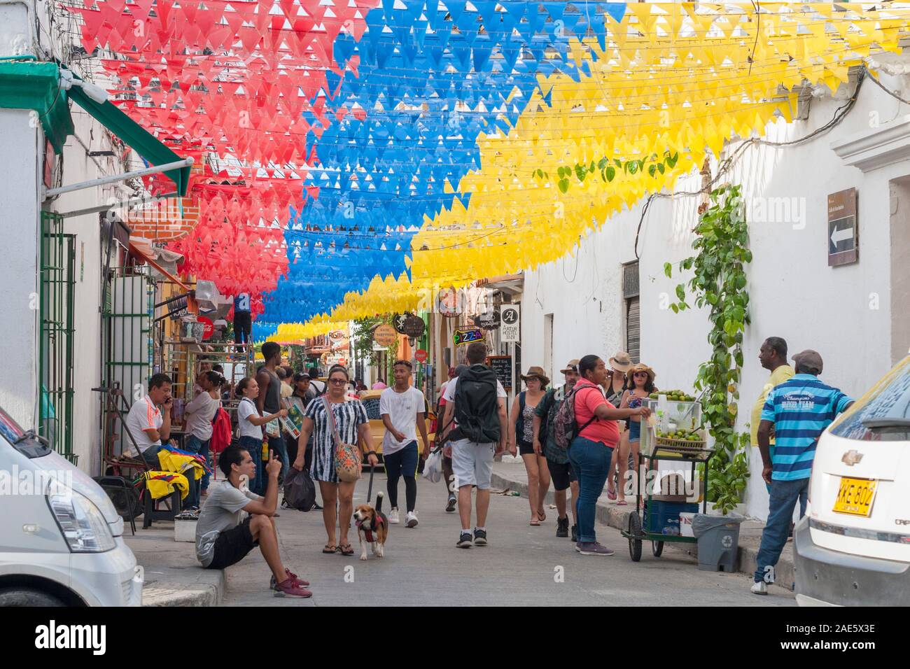 Banners in the national colours of Colombia adorning 10th street (carrera  10) in the Getsemani neighborhood of Cartagena, Colombia Stock Photo - Alamy