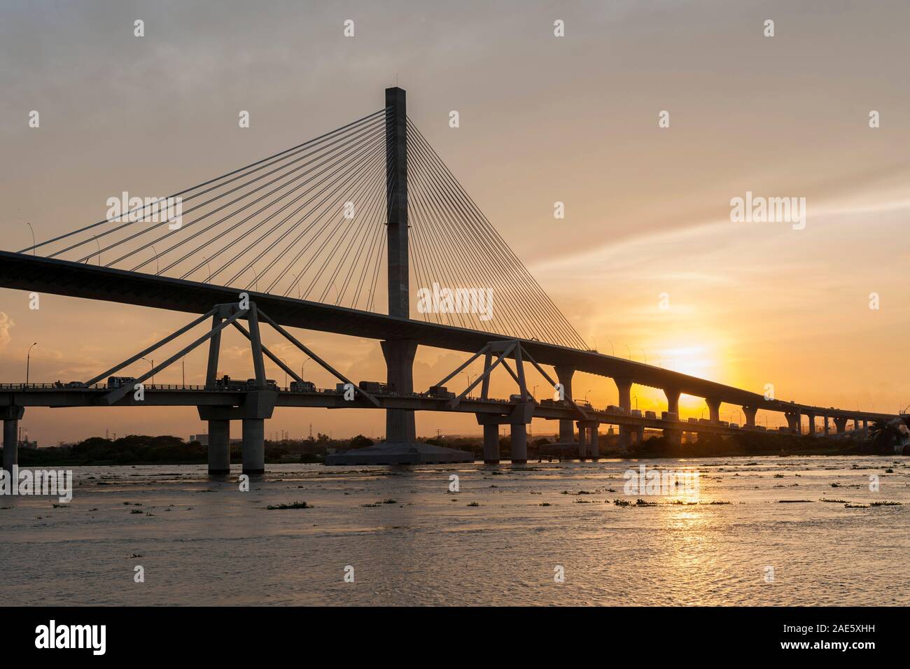 The old and new Pumarejo bridges (officially the Laureano Gómez bridge) and the Magdalena River in Barranquilla, Colombia. Stock Photo