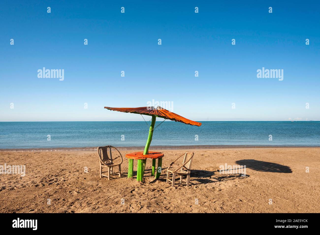 Table and chairs on the beach at Cabo de la Vela in the Guajira peninsula of northern Colombia. Stock Photo