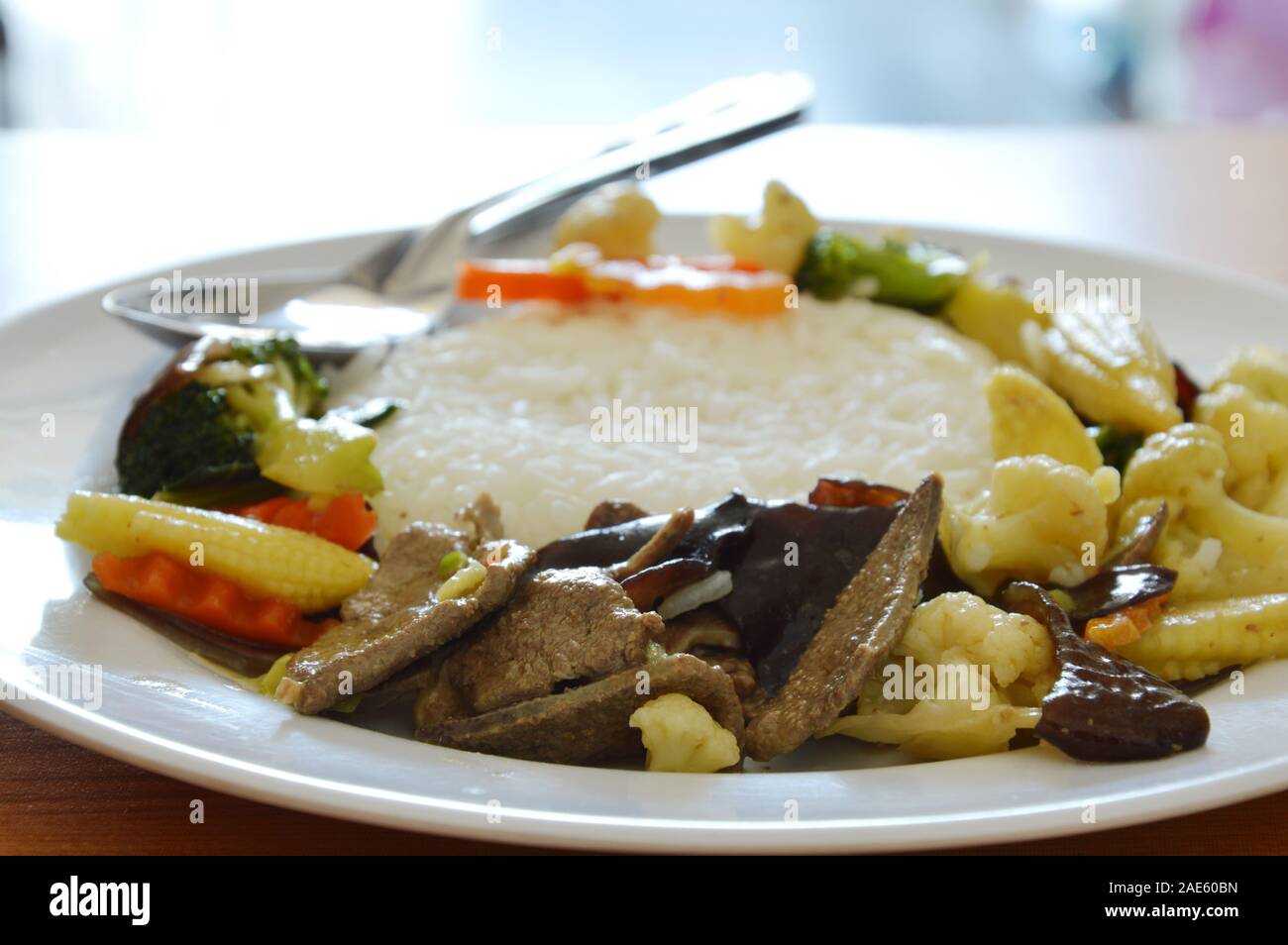 stir fried mixed vegetable with pork liver on rice Stock Photo