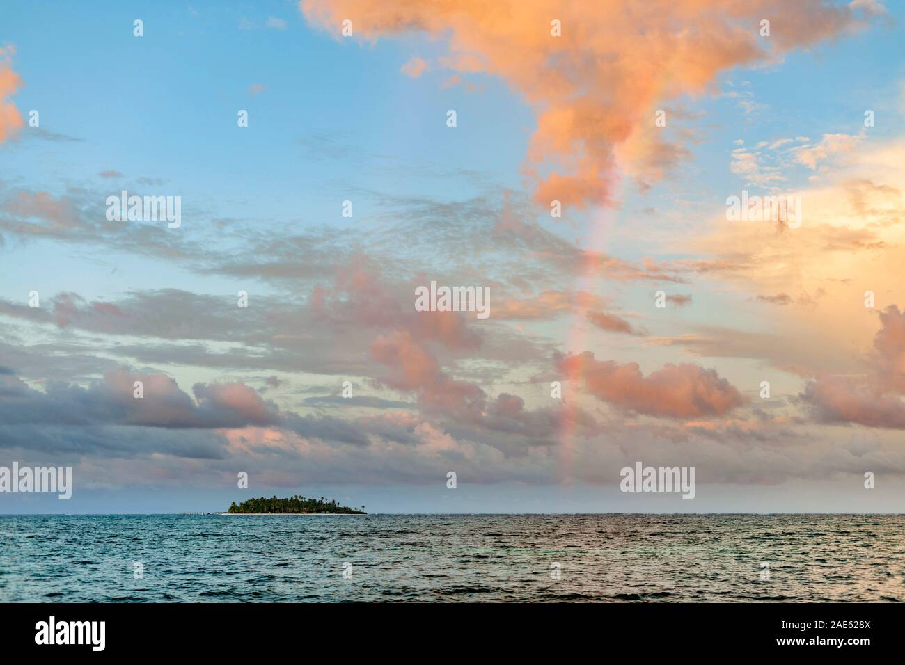 A rainbow and Islote sucre (Sucre islet) off the coast of the island of San Andres, Colombia. Stock Photo
