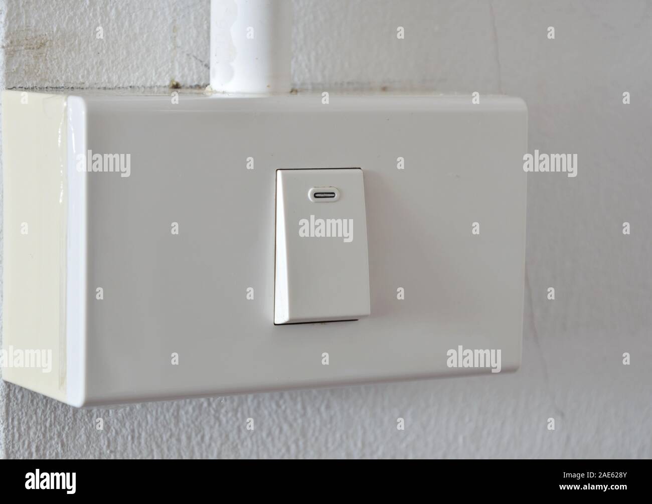 toggle switch in plastic box on the wall Stock Photo