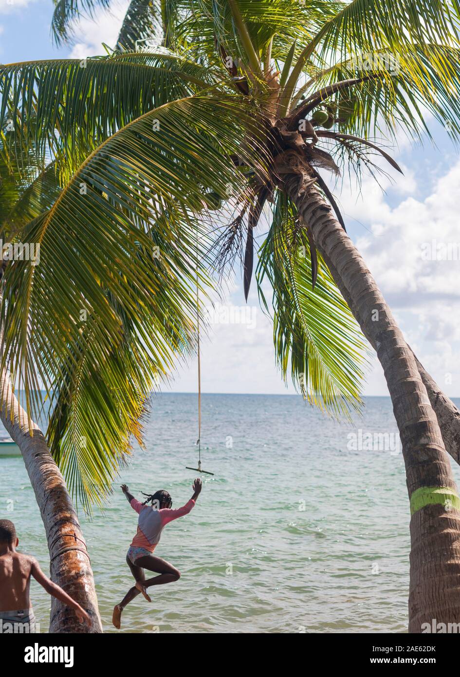 Kids playing at Manzanilla beach on the island of Providencia in Colombia. Stock Photo