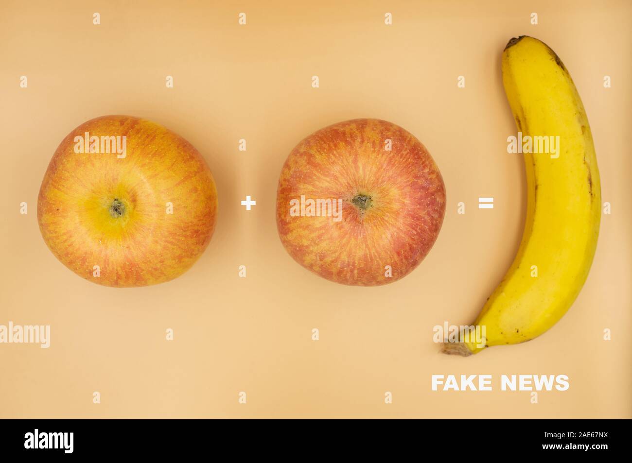 Two apples added together equal a banana,concept image of Fake News. Stock Photo