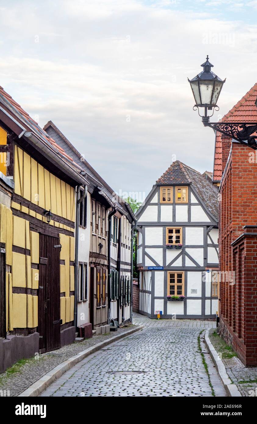 Cobblestobe street and timber frame buildings in historic Altstadt Tangermünde Saxony-Anhalt Germany. Stock Photo