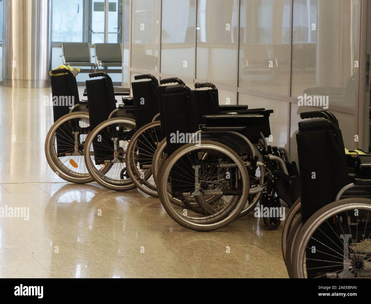 Wheelchairs in the airport. Help for disabled persons Stock Photo Alamy