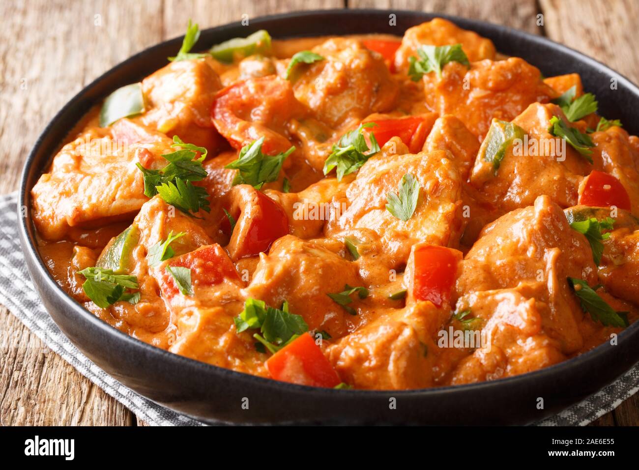 Authentic african chicken mafe in peanut sauce, with tomatoes, peppers
