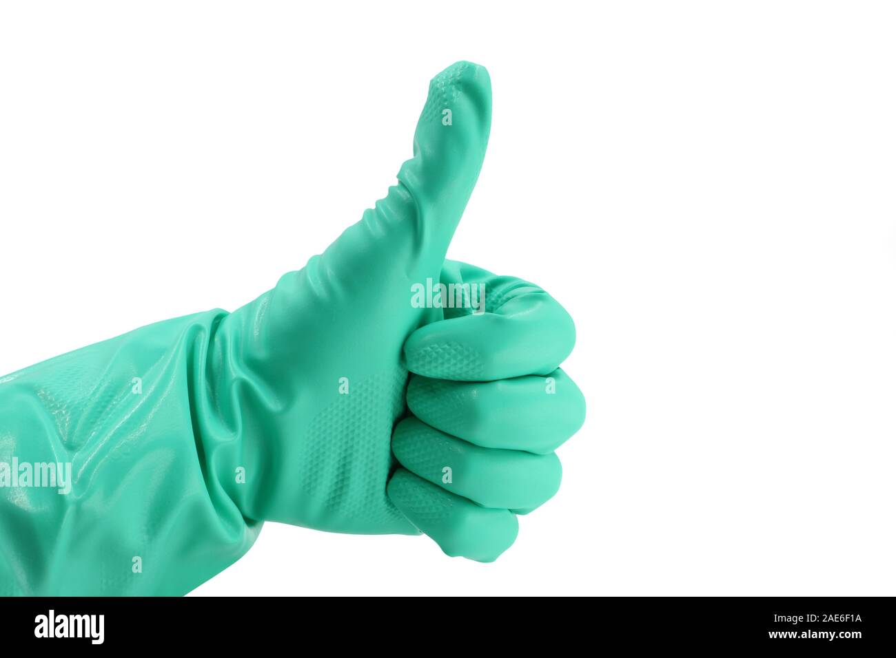 Thumbs up with a green vinyl glove on white background Stock Photo
