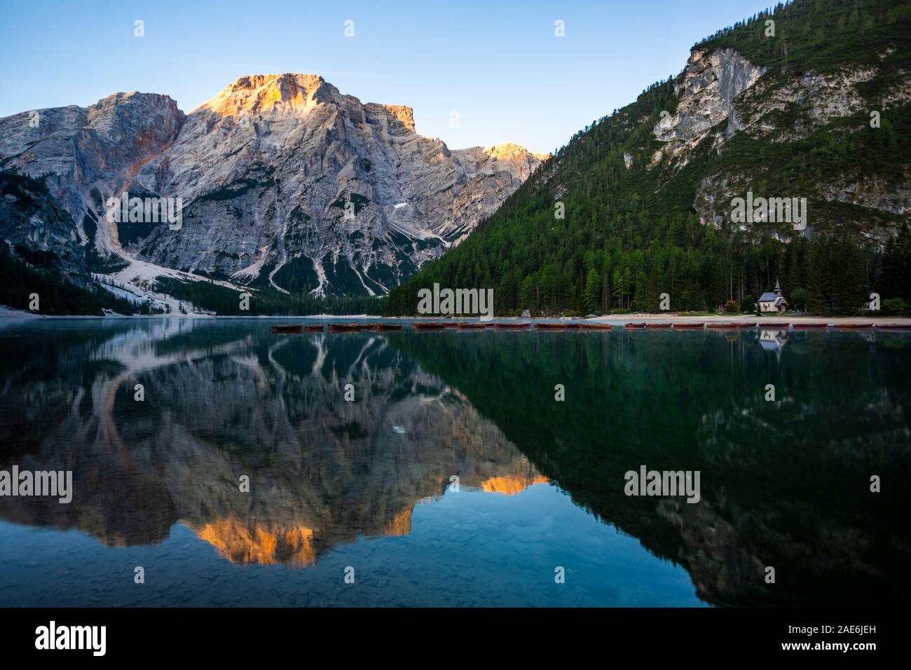Beautiful reflection of Seekofel mountain in Lake Braies at sunrise, Italy Stock Photo